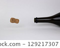 Champagne cork flying out to the left 129217307