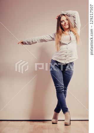 fashionable woman in shirt denim pants fashionable woman in shirt denim pants 129217507