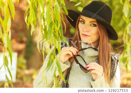 Adorable woman in sunglasses Adorable woman in sunglasses 129217553