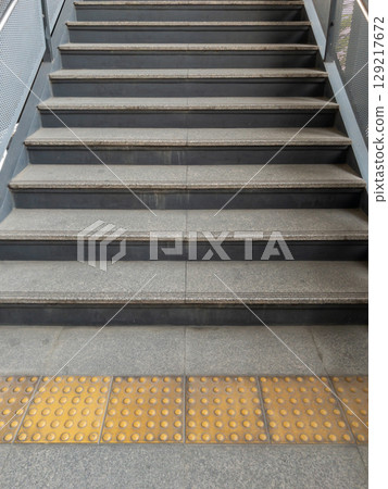 Tactile Staircase at Urban Train Station. Tactile Staircase at Urban Train Station. 129217672