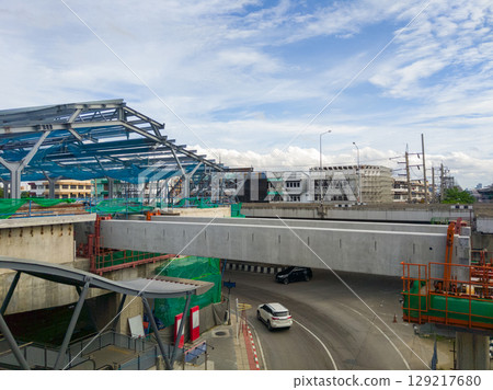 Monorail Station Construction at City Intersection. Monorail Station Construction at City Intersection. 129217680
