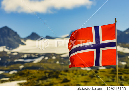 Norwegian flag and mountains snowy landscape Norwegian flag and mountains snowy landscape 129218133