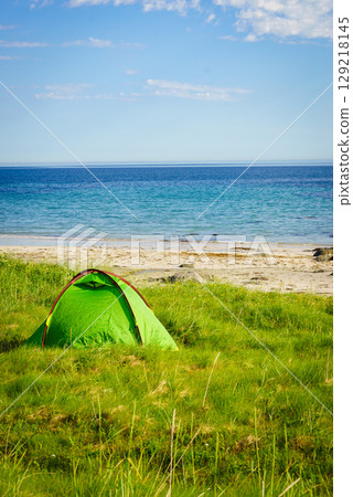Seascape with tent on beach, Lofoten Norway Seascape with tent on beach, Lofoten Norway 129218145
