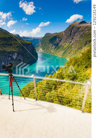 Camera on tripod taking fjord photo, Norway Camera on tripod taking fjord photo, Norway 129218149