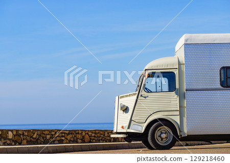 Vintage caravan camping on coast Vintage caravan camping on coast 129218460