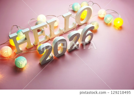 Hello 2026 alphabet letter with cotton ball LED decoration on pink background Hello 2026 alphabet letter with cotton ball LED decoration on pink background 129218495