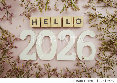 Hello 2026 Happy New Year with flower decoration on pink background 129218679