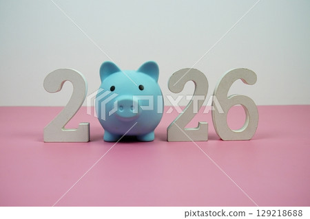 New Year 2026 saving money and start investment concept with piggy bank 129218688