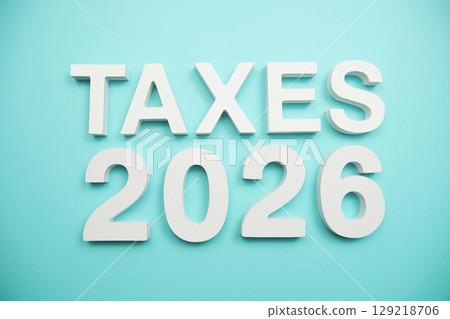 Taxes 2026 alphabet letters on blue background 129218706