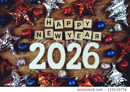Happy New Year 2026 alphabet letters with Christmasl Decoration on wooden background 129218756