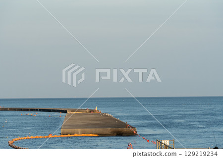Blue sky and a car crossing an iron bridge 129219234