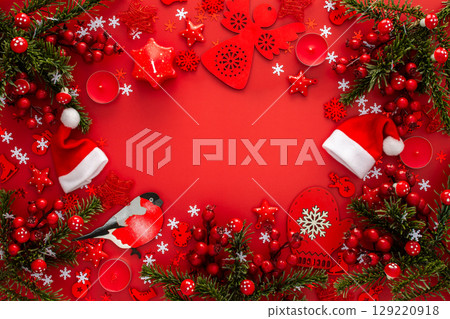 Red Christmas background with fir branches Red Christmas background with fir branches 129220918