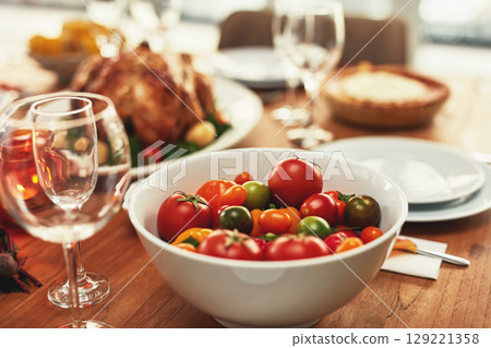 Food, traditional and celebration with tomato on table for thanksgiving, meal and luxury, turkey and nobody. Chicken, nutrition and family lunch setup for christmas, sunday or family reunion party Food, traditional and celebration with tomato on table for thanksgiving, meal and luxury, turkey and nobody. Chicken, nutrition and family lunch setup for christmas, sunday or family reunion party 129221358