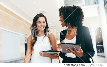 Collaboration, planning and tablet with business women for partnership, review and communication. Teamwork, diversity and global with employee in office building for management, strategy and vision 129221479