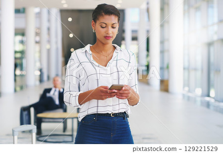 Business woman, phone or reading email communication on web app while sitting at office. Black woman smartphone typing, message app or social media on mobile smartphone or internet technology at work 129221529