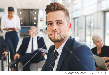 Businessman, meeting and portrait with team planning, teamwork and leadership in management, collaboration and workshop. Business people, face and staff talking strategy, vision and goal in office 129221531