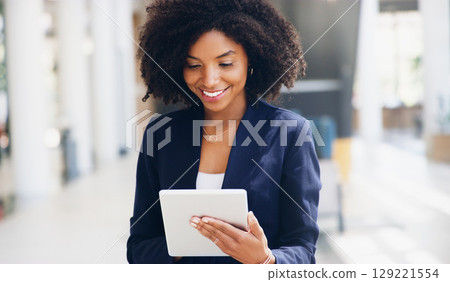 Digital tablet, office and business woman reading information documents online on the internet. Happy, smile and young professional manager working on a mobile device for management project or report Digital tablet, office and business woman reading information documents online on the internet. Happy, smile and young professional manager working on a mobile device for management project or report 129221554