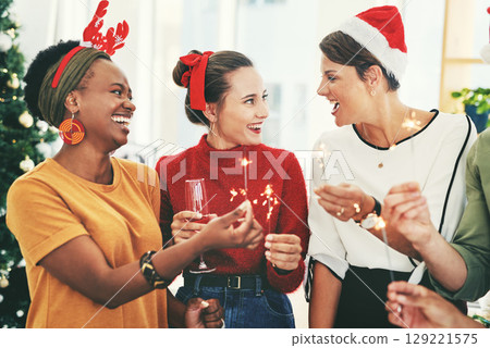 Christmas, party and sparklers with business people in office for celebration, champagne and festive season. Diversity, teamwork and friends with employee and drink glass for holiday, cheers or event 129221575
