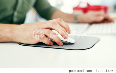 Hand, computer mouse and ecommerce with a business man working on a desktop in his company office. Marketing, software and networking with a male employee clicking a button while working alone Hand, computer mouse and ecommerce with a business man working on a desktop in his company office. Marketing, software and networking with a male employee clicking a button while working alone 129221586