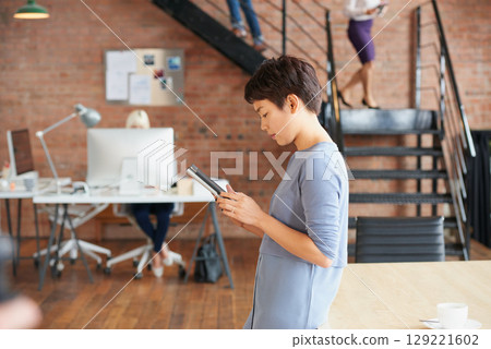 Business woman, tablet and digital marketing while online doing internet research for copywriting for target audience on social media platform. Content creator entrepreneur at a advertising agency 129221602