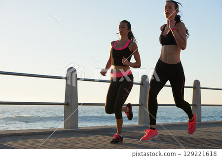 Running, beach and woman of friends with fitness goals, body wellness and teamwork on morning blue sky mockup. Accountability, personal trainer and sports, athlete or runner people training outdoor 129221618