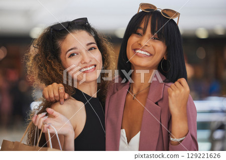 Luxury retail, fashion and friends shopping for commercial goods, designer clothes and modern boutique store with shopping bag. Happy woman, friendship and women hug in Paris look for sales discount 129221626