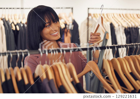 Woman in designer store, clothes shopping for luxury fashion dress or professional stylist choosing outfit in New York. Happy customer searching rack, sale in boutique shop or retail service industry Woman in designer store, clothes shopping for luxury fashion dress or professional stylist choosing outfit in New York. Happy customer searching rack, sale in boutique shop or retail service industry 129221631