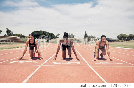 Marathon, ready and sports women group or runner at a stadium race track for competition, game and event with focus, motivation and goal. International athlete people in line for a running challenge Marathon, ready and sports women group or runner at a stadium race track for competition, game and event with focus, motivation and goal. International athlete people in line for a running challenge 129221734