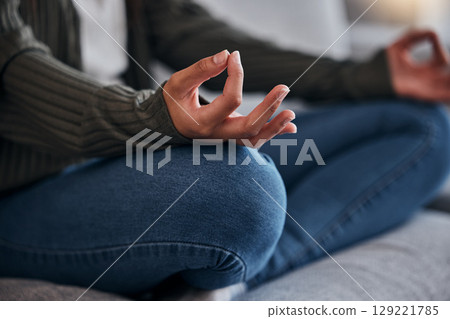Meditation, lotus hands and woman with zen and yoga at home, mindfulness and chakra balance for positive energy and wellness. Meditate on sofa, spiritual and peace, calm stress relief and healing. 129221785