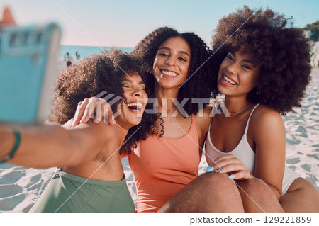 Summer selfie, beach and black women friends enjoy holiday, vacation and weekend travel together. Happiness, ocean and group of people smiling, laughing and fun for social media picture at sea 129221859