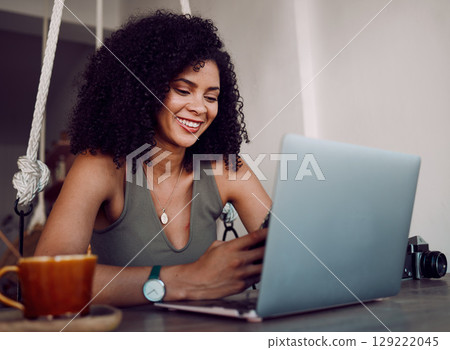 Phone, freelance photographer black woman in cafe and laptop typing on smartphone checking social media. Freelancer at remote work, reading good news email for creative project in coffee shop. Phone, freelance photographer black woman in cafe and laptop typing on smartphone checking social media. Freelancer at remote work, reading good news email for creative project in coffee shop. 129222045