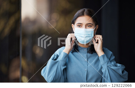 Face mask, woman and covid business worker in an office with health and corona virus safety. Company employee doing covid 19 healthy security policy in the workplace ready for office working 129222066