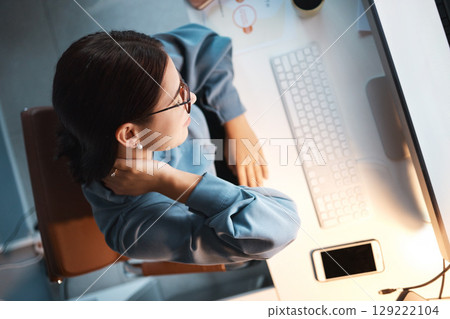 Neck pain, tired and woman in office at night working on project, report or programming issue. Injury, fatigue and muscle tension of coding expert at computer late top view with mockup screen. Neck pain, tired and woman in office at night working on project, report or programming issue. Injury, fatigue and muscle tension of coding expert at computer late top view with mockup screen. 129222104