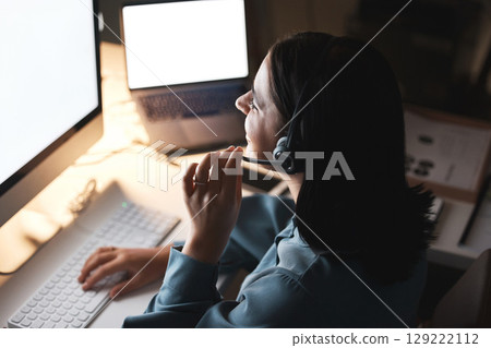 Call center, computer screen and woman with business communication, multimedia IT support and virtual advice in e commerce. Happy telemarketing, insurance advisor or digital crm agent in night office Call center, computer screen and woman with business communication, multimedia IT support and virtual advice in e commerce. Happy telemarketing, insurance advisor or digital crm agent in night office 129222112
