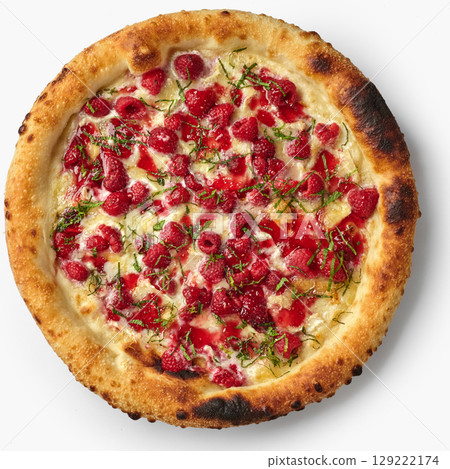 Delicious gourmet pizza with raspberries, brie cheese and mint leaves displaying culinary creativity 129222174