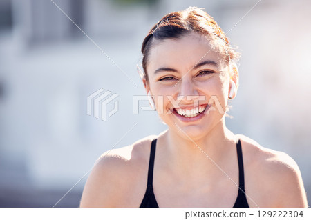 Earphones, face and sports woman in city streaming music, podcast or radio. Portrait, fitness and female from Australia outdoors listening to audio and getting ready for training, running or workout 129222304