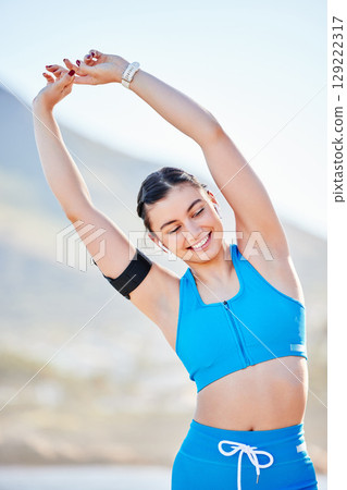 Nature, fitness and stretching woman or runner for workout, training and outdoor wellness in summer or sunshine on mountain. Happy, healthy and body of sports girl warm up or cardio with calm energy 129222317