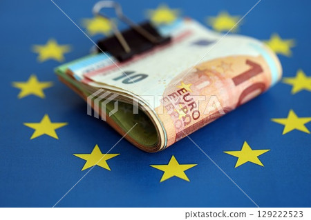 European euro currency money notes bunch on Europe union blue flag close up 129222523