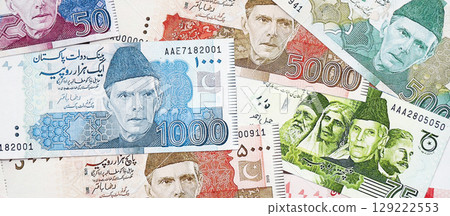 Pakistan rupees banknotes. The current Pakistan money bills lies on table in big amount 129222553