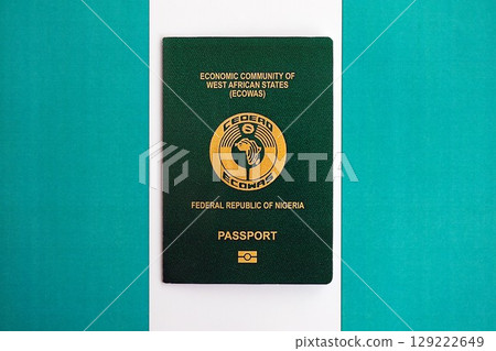 Nigerian passport on flag. The concept of citizenship Nigerian passport on flag. The concept of citizenship 129222649