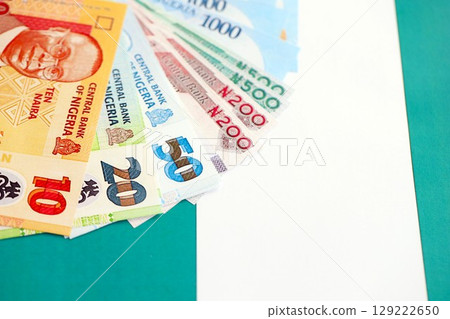 Nigerian naira currency money bills lies on flag. The concept of business and investment Nigerian naira currency money bills lies on flag. The concept of business and investment 129222650