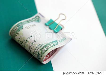 Nigerian naira currency money bills lies on flag. The concept of business and investment 129222653