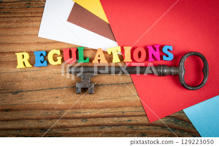 Regulations Concept with Colorful Letters and Vintage Key Regulations Concept with Colorful Letters and Vintage Key 129223050