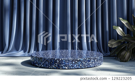 Luxurious blue stone podium surrounded by exotic foliage in an elegant sunlit setting 129223205
