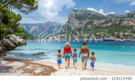 Vibrant family in bright activewear jogging on the beach with stunning ocean backdrop 129223498