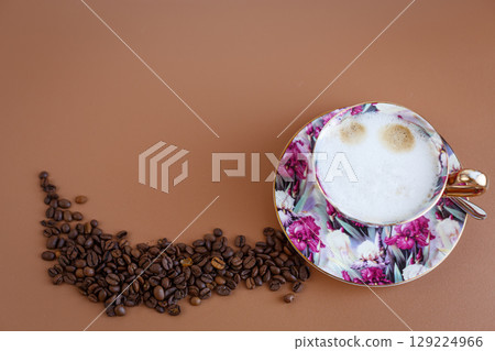 Elegant cappuccino with floral cup and mocha background Elegant cappuccino with floral cup and mocha background 129224966