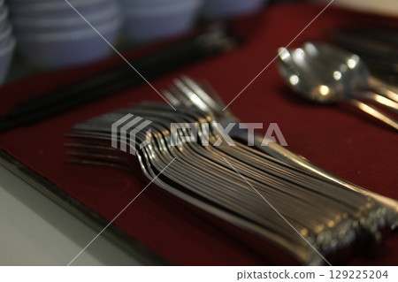 Fork, spoon, chopsticks set of kitchen utensils for business lunch 129225204