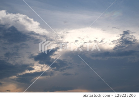 Sunset on blue sky. Blue sky with some clouds. blue sky clouds, summer skies, cloudy blue sky 129225206