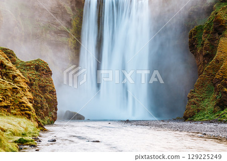Lovely view of famous Skogafoss waterfall and scenic surroundings. Location place Skoga river, Iceland, Europe. Lovely view of famous Skogafoss waterfall and scenic surroundings. Location place Skoga river, Iceland, Europe. 129225249
