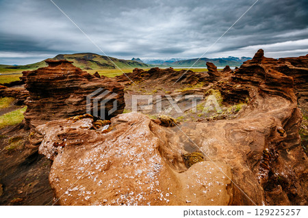 Sandy rocks with by magma formed by winds. Location place Sudurland, Iceland. 129225257